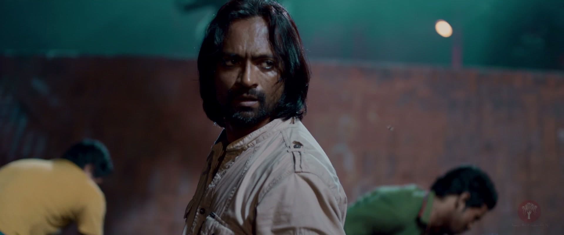 Bullet Bhaiya looking back over his shoulder at night